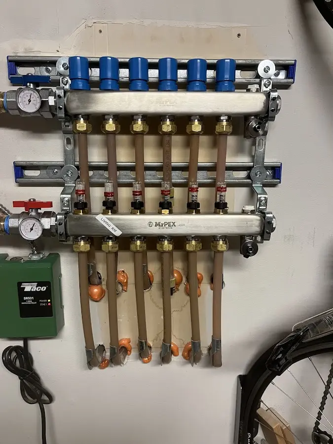 Plumber performing Water Heater Repair at a residential property in Bartlett